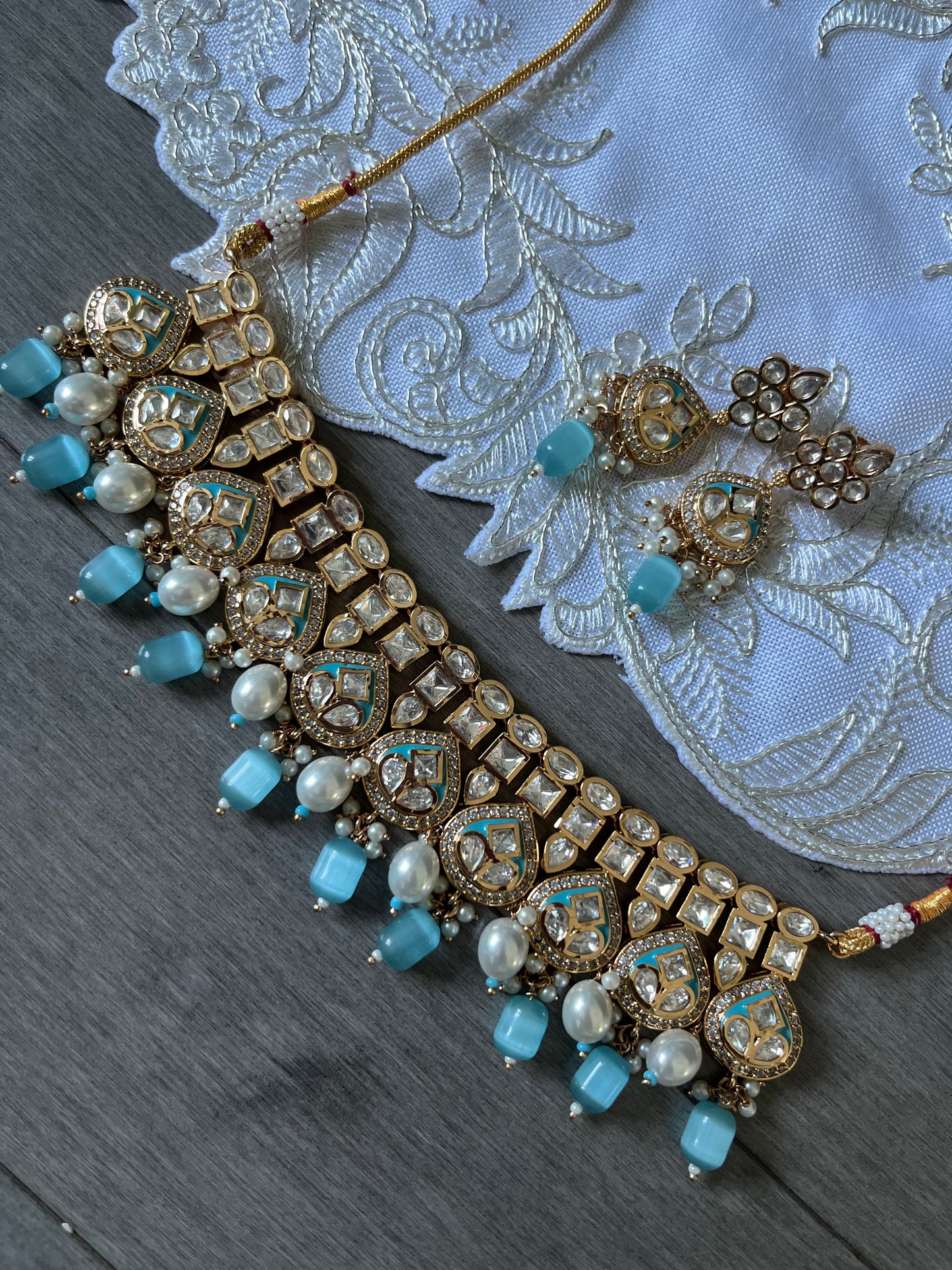 Tyaani rose gold base kundan set with earrings