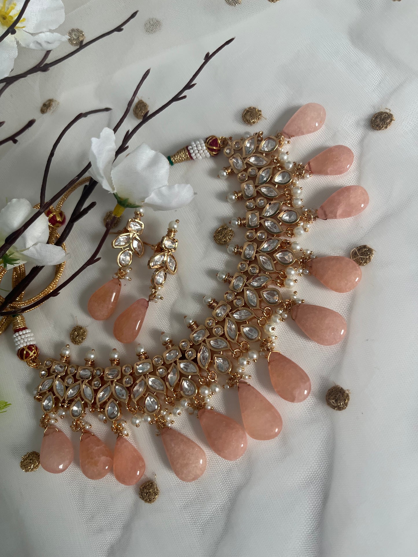 Tyaani rose gold base kundan set (necklace with earrings)
