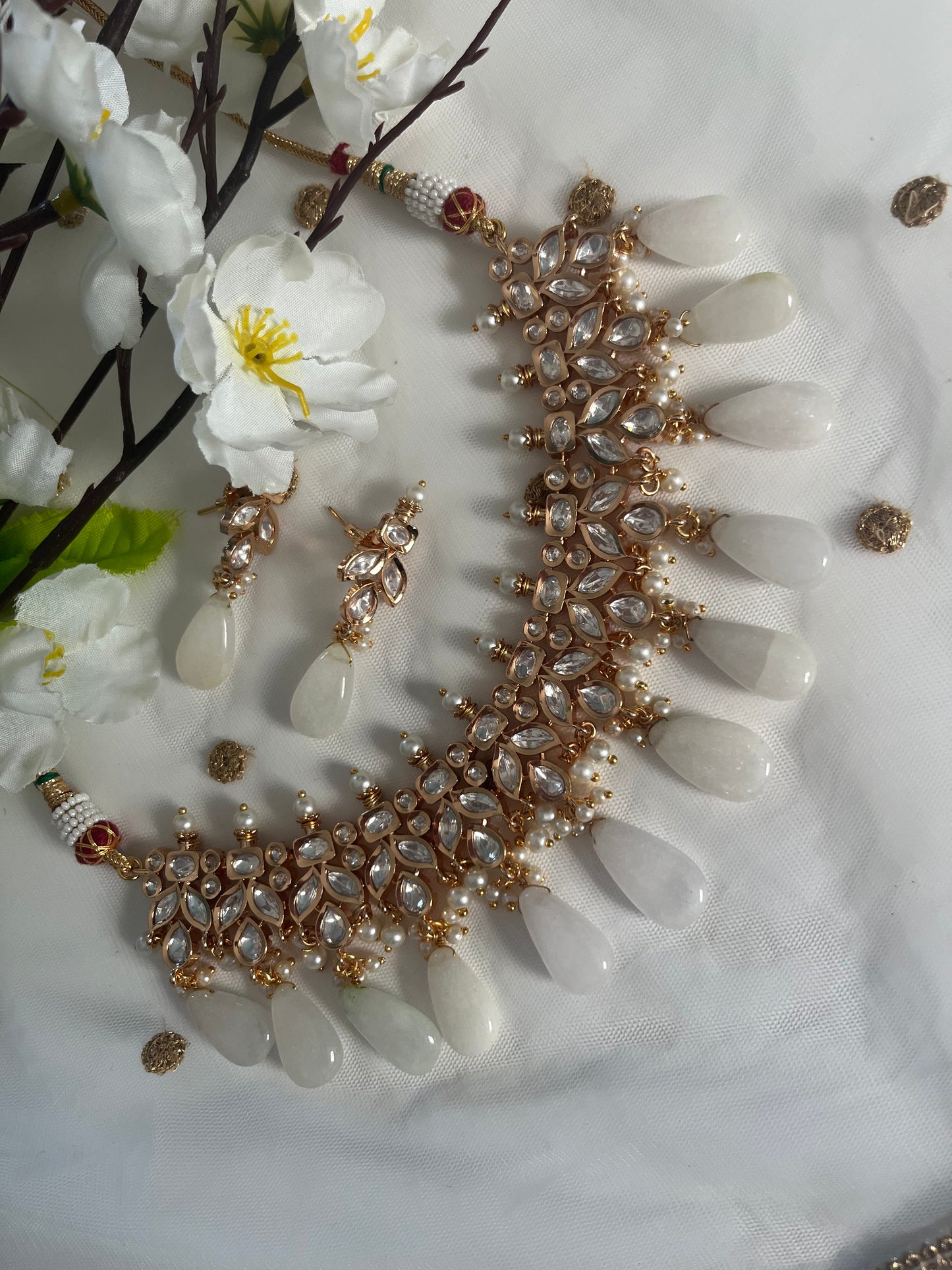Tyaani rose gold base kundan set (necklace with earrings)